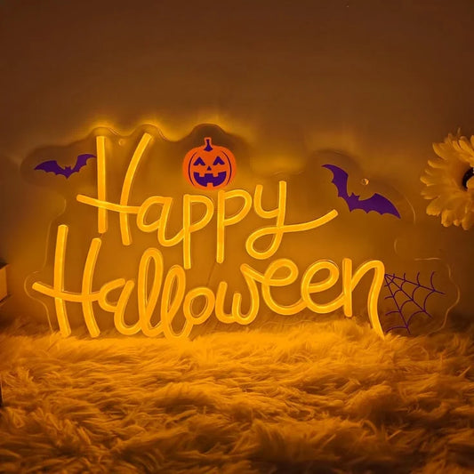 A glowing LED Halloween neon sign featuring a Happy Halloween message, a jack-o'-lantern, purple bats and a spiderweb on a dark background.
